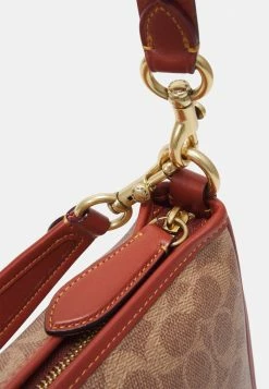 Coach SIGNATURE CARY SHOULDER BAG - Handbag - Tan Rust 9 Coach SIGNATURE CARY SHOULDER BAG - Handbag - Tan Rust -Coach Shop 0e1d27a859814ec4908aa3e4e847abfd