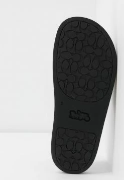 Coach UDELE SPORT SLIDE SIGNATURE COATED - Mules - Tan -Coach Shop 318f534fbeb2451ab39f7795df1e76eb