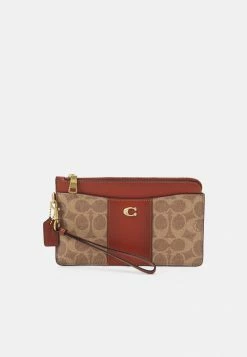 Coach COATED SIGNATURE ZIP WRISTLET - Wallet - Tan/rust