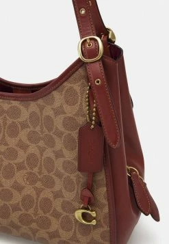 Coach COATED CANVAS SIGNATURE ARCHIVAL EDIE - Handbag - Tan Rust -Coach Shop 4c853124d389449db0193e6d8590c39d