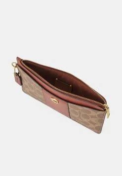 Coach COATED SIGNATURE ZIP WRISTLET - Wallet - Tan/rust -Coach Shop 63ae9cddf83f4375b98867ac34e4fc31