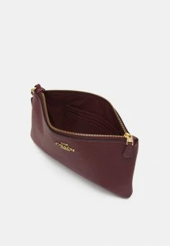 Coach POLISHED PEBBLE SMALL WRISTLET - Clutch - Wine -Coach Shop 99a18c244e6b4feab2f00df918706a50