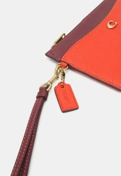 Coach COLORBLOCK ZIP WRISTLET - Wallet - Red Orange Multi -Coach Shop a6bc65147e0244a0a7eafa164d83f60d
