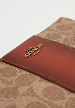 Coach COATED SMALL WRISTLET - Wallet - Tan Rust 10 Coach COATED SMALL WRISTLET - Wallet - Tan Rust -Coach Shop a73237a27cd24def90fefa8b1d871054