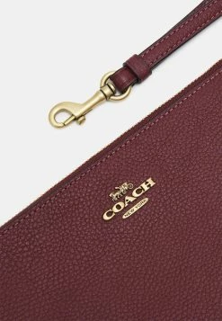 Coach POLISHED PEBBLE SMALL WRISTLET - Clutch - Wine -Coach Shop c4045d9f5937409fad5b6248a166860a