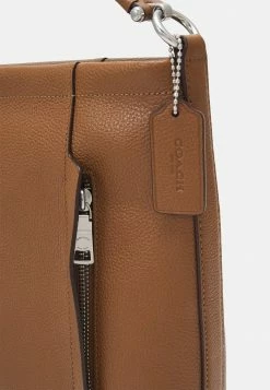 Coach POLISHED PEBBLED SCOUT HOBO - Handbag - Saddle -Coach Shop c4c2dd8f6e374ea291ca01747e0f1936