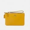 Coach POLISHED SMALL WRISTLET - Clutch - Buttercup