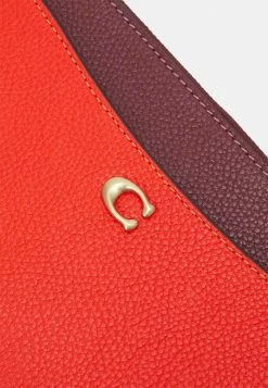 Coach COLORBLOCK ZIP WRISTLET - Wallet - Red Orange Multi -Coach Shop d91e8007b136496cb082861ce4cc604b