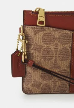 Coach COATED SIGNATURE ZIP WRISTLET - Wallet - Tan/rust -Coach Shop e44125c27ad54fca81e8a907012a89bb