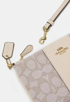 Coach SIGNATURE SMALL WRISTLET - Wallet - Stone Ivory -Coach Shop f0afa519e3cd42a2a6c0ed8fe319a43f