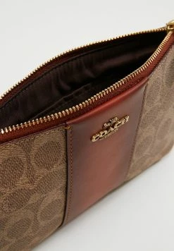 Coach COATED SMALL WRISTLET - Wallet - Tan Rust 13 Coach COATED SMALL WRISTLET - Wallet - Tan Rust -Coach Shop f3e771199ffc4117b14805a7f8c6f02b