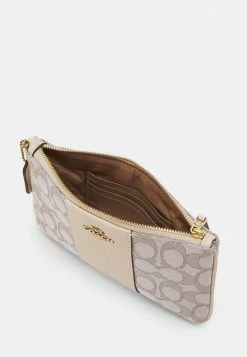 Coach SIGNATURE SMALL WRISTLET - Wallet - Stone Ivory -Coach Shop fb513301fa5144309f34bed330276c1d
